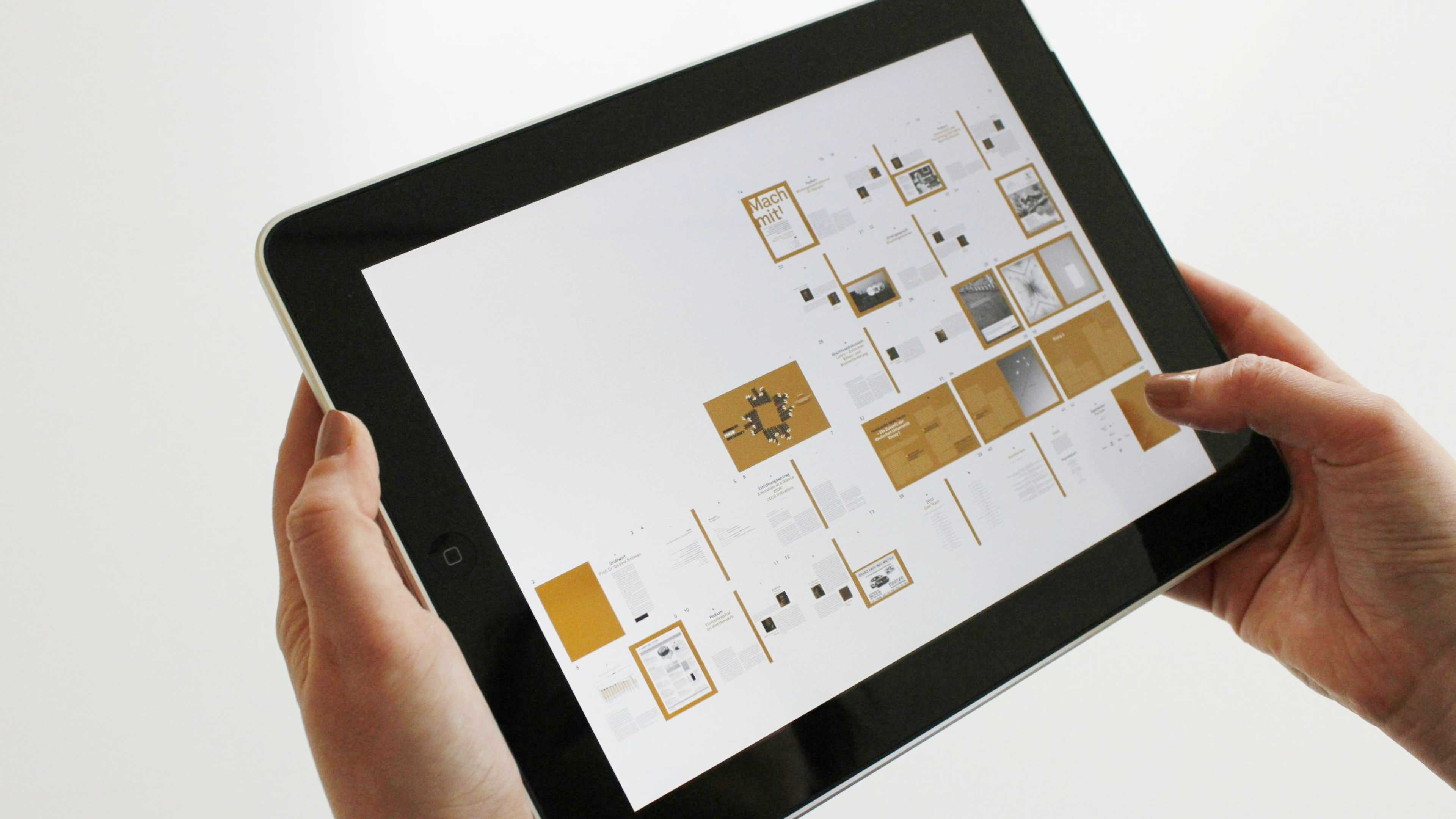 Image of a man using an iPad with information architecture on the screen