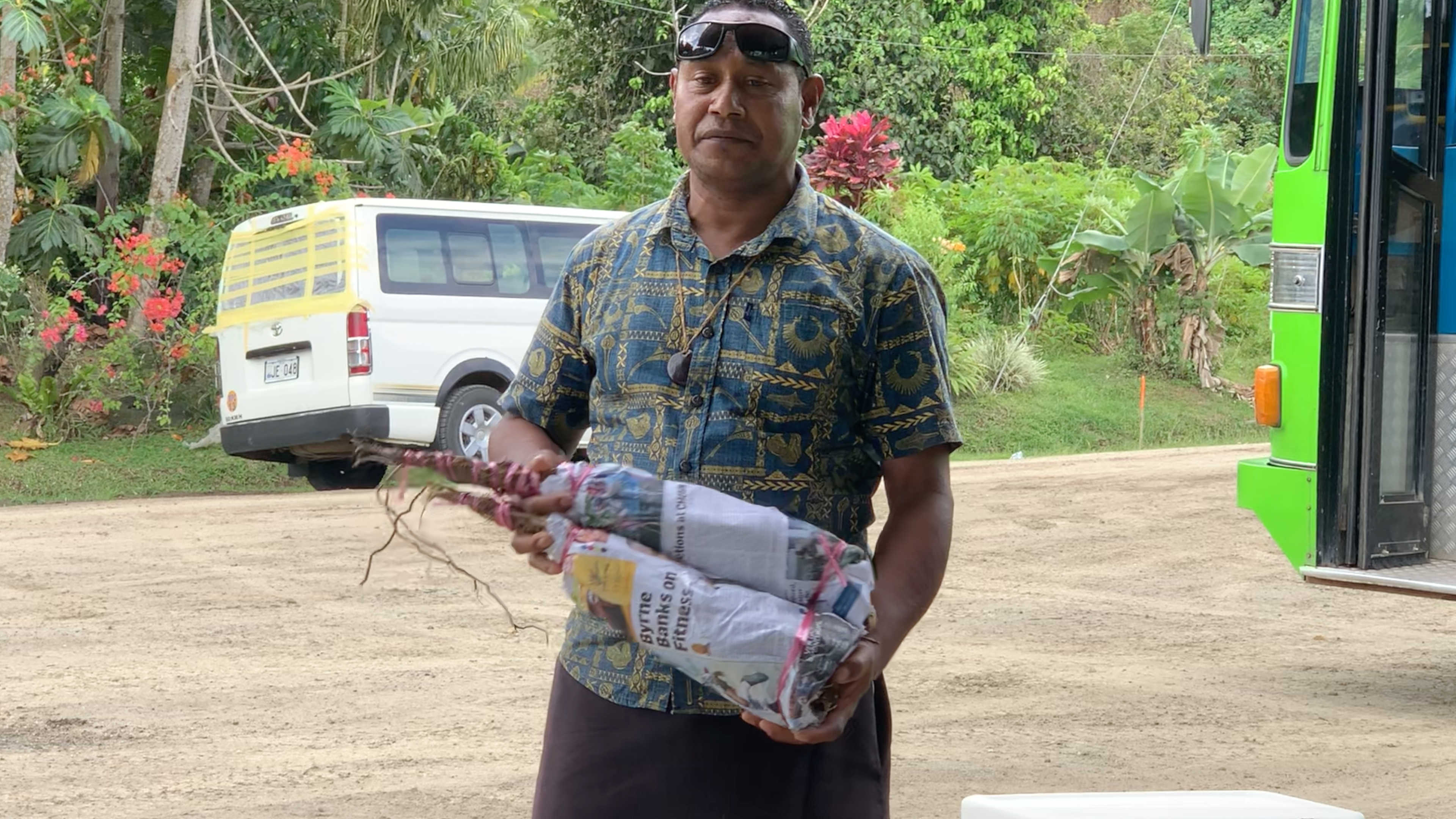 Me standing with my mom, brother and sister along with our Fijian resort host Gabi