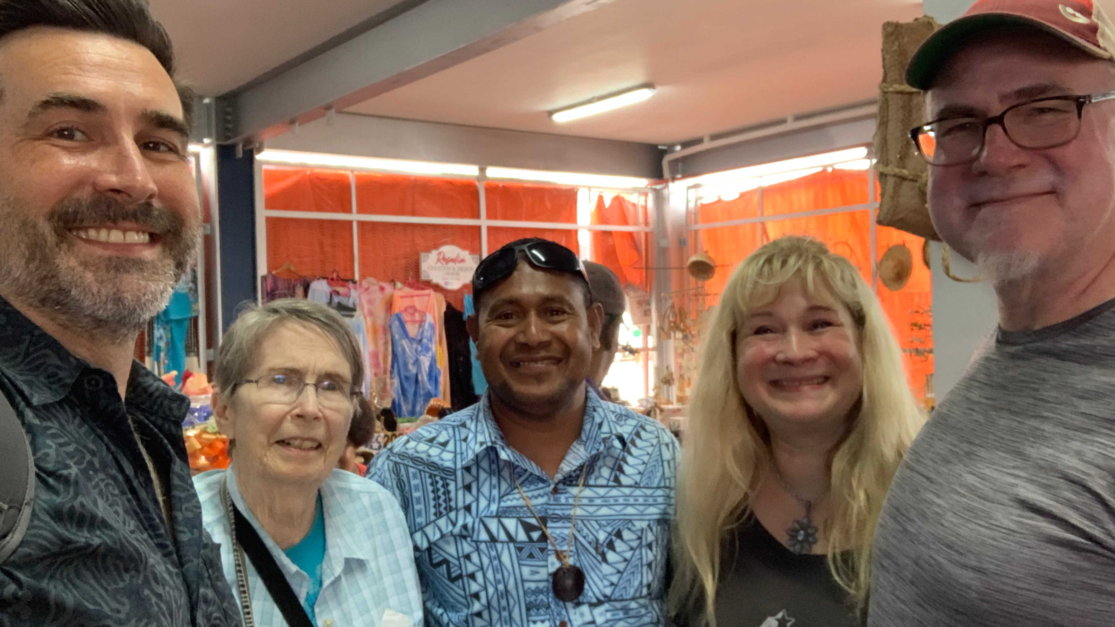 Me standing with my mom, brother and sister along with our Fijian resort host Gabi