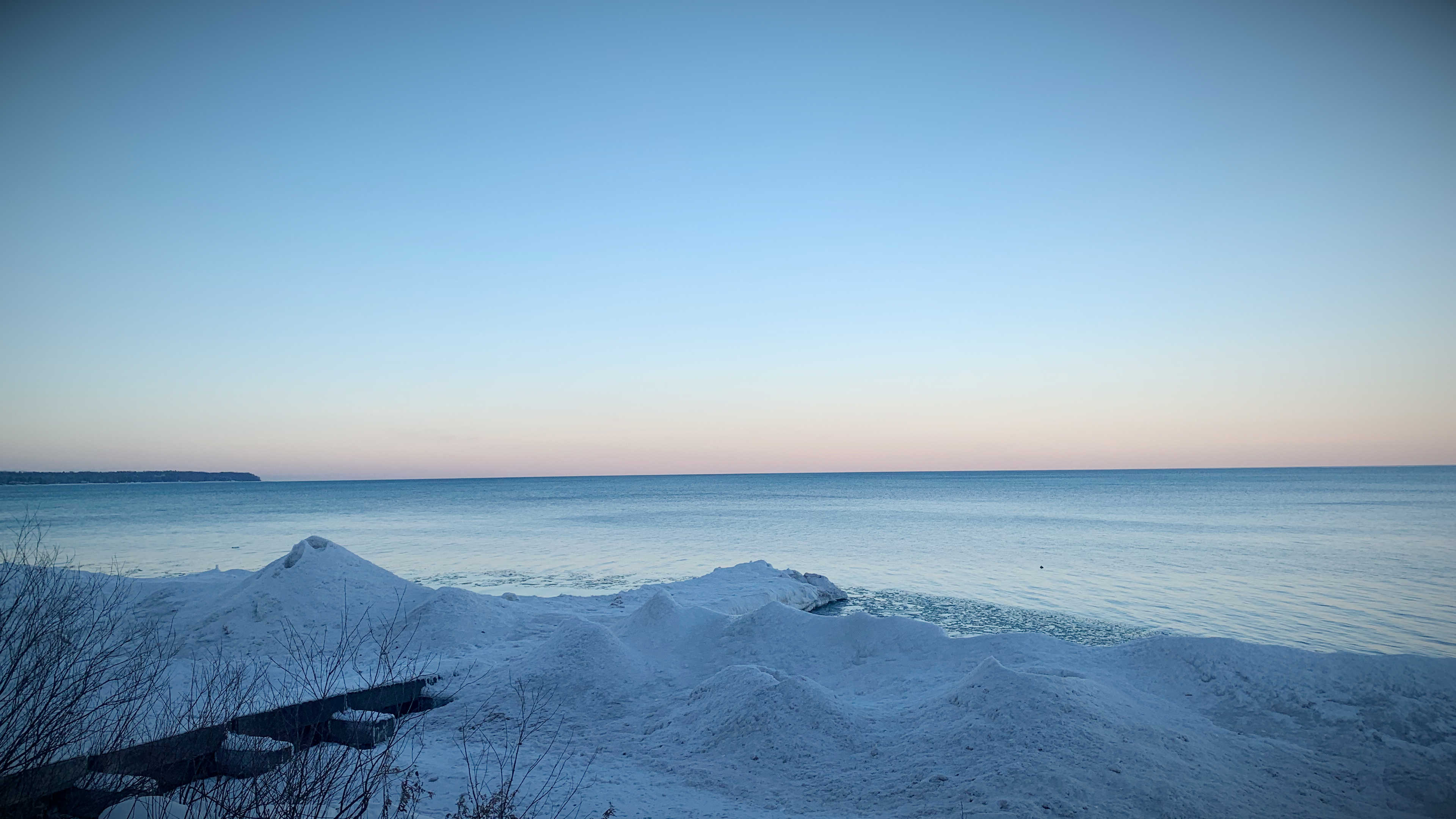 The frozen beach and pier at Big Bay Park