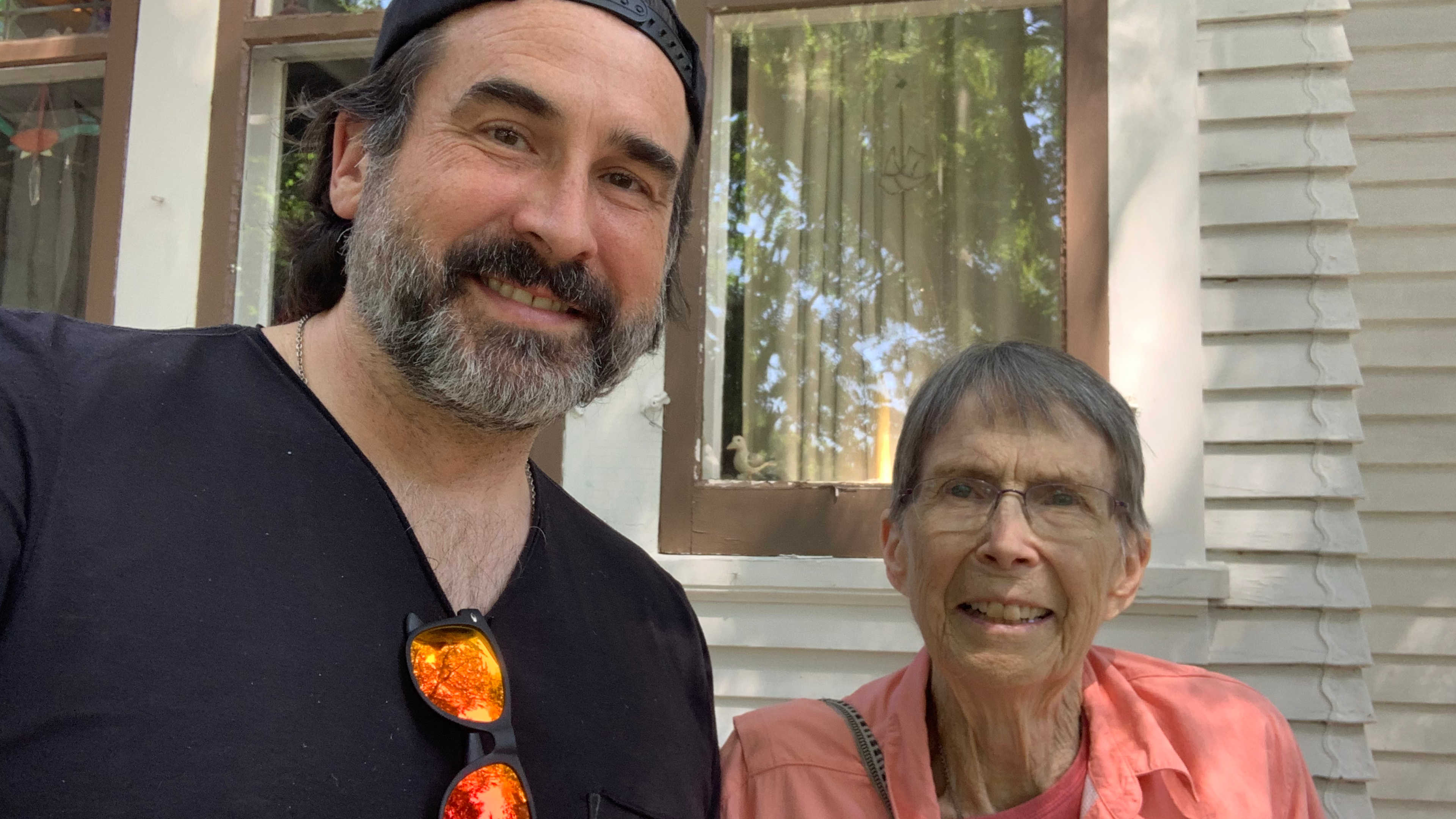Me and my mom outside our family home in summer